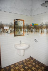 a bathroom with a sink and a mirror on the wall at Jayanika Residence in Tangalle +31 photos