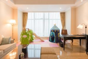 Posezení v ubytování Qingdao Jianxin International Hotel