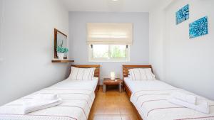 Ένα ή περισσότερα κρεβάτια σε δωμάτιο στο Ayia Napa Holiday Villa 036 +30 φωτογραφίες