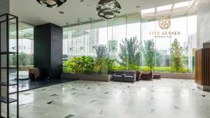 a lobby of a building with a large glass wall at Dua Sentral Kuala Lumpur by Five Senses in Kuala Lumpur