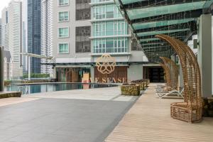 a resort with a swimming pool and buildings at Dua Sentral Kuala Lumpur by Five Senses in Kuala Lumpur
