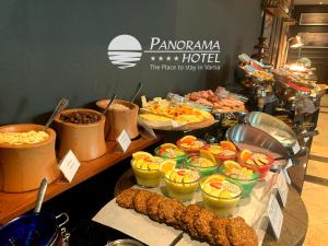 a buffet of food on a table in a restaurant at Panorama Hotel - Free EV Charging Station in Varna City
