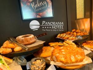 a bunch of different types of bread and pastries at Panorama Hotel - Free EV Charging Station in Varna City