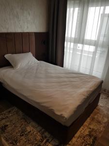 מיטה או מיטות בחדר ב-MY HOTEL
