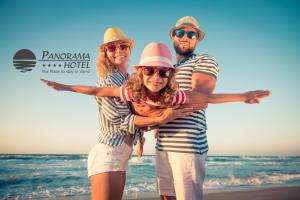a group of people standing on the beach at Panorama Hotel - Free EV Charging Station in Varna City