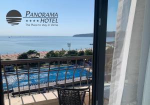 a balcony with a view of a swimming pool at Panorama Hotel - Free EV Charging Station in Varna City
