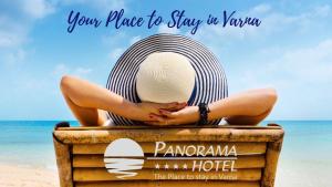 a woman sitting on a chair at the beach at Panorama Hotel - Free EV Charging Station in Varna City