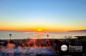 a sunset over the ocean with the sun in the sky at Panorama Hotel - Free EV Charging Station in Varna City