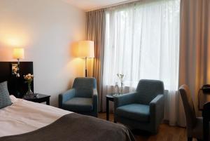 Postel nebo postele na pokoji v ubytování Elite Stadshotellet Västerås