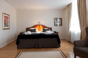 Postel nebo postele na pokoji v ubytování Elite Stadshotellet Västerås