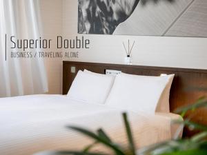 Postel nebo postele na pokoji v ubytování Hotel Gracery Naha