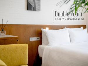 Postel nebo postele na pokoji v ubytování Hotel Gracery Naha