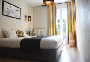 Katil atau katil-katil dalam bilik di Hotel Epi d'Or