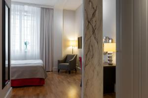 Postel nebo postele na pokoji v ubytování Elite Stadshotellet Västerås