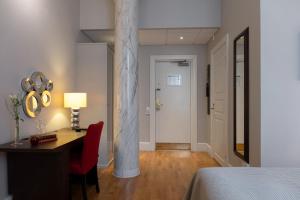 Postel nebo postele na pokoji v ubytování Elite Stadshotellet Västerås