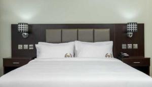 Łóżko lub łóżka w pokoju w obiekcie Mbale Courts View Hotel