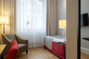 Postel nebo postele na pokoji v ubytování Elite Stadshotellet Västerås