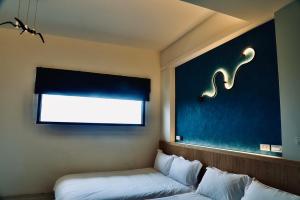 TV a/nebo společenská místnost v ubytování Qian Qian Riverside B&B