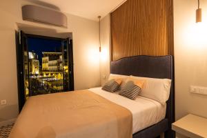 Posteľ alebo postele v izbe v ubytovaní Apartamentos El Patio, Plaza Mayor Trujillo