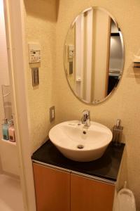 a bathroom with a sink and a mirror at Gion Shirakawa - Vacation STAY 24781v in Kyoto +12 photos