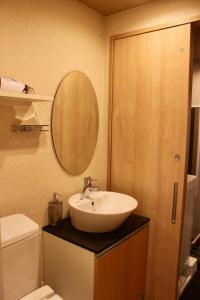 a bathroom with a sink and a mirror at Gion Shirakawa - Vacation STAY 24783v in Kyoto