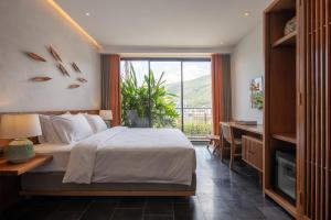 Postel nebo postele na pokoji v ubytování Le Mint Hotel Quy Nhơn + 107 fotografií