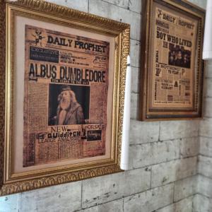 a newspaper hanging on a brick wall at La cabane des sorciers in Liévin