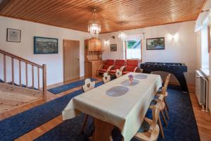 a dining room with a table and a pool table at Family Friendly House Marija - Happy Rentals in Gradišča