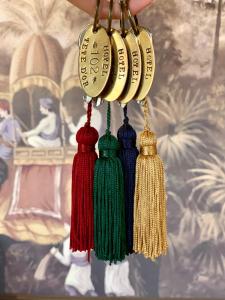 a group of tassels hanging from a wall at Hôtel Tête d'or in Lyon