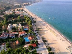 an aerial view of a beach and the ocean at Alexander Apartments in Skala