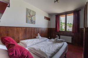 Postel nebo postele na pokoji v ubytování Hotel Le Refuge