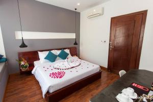 Siem Reap Tevi Residence tesisinde bir odada yatak veya yataklar