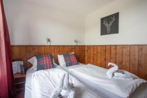Postel nebo postele na pokoji v ubytování Hotel Le Refuge