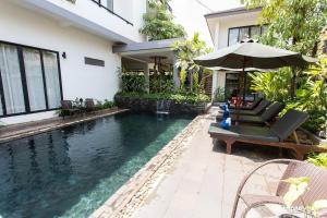 Bazén v ubytování Siem Reap Tevi Residence nebo v jeho okolí