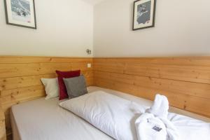 Postel nebo postele na pokoji v ubytování Hotel Le Refuge