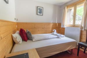 Postel nebo postele na pokoji v ubytování Hotel Le Refuge
