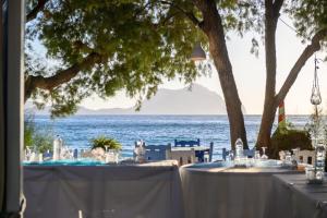 a table set up for a wedding on the beach at Lakki Village in Aegiali