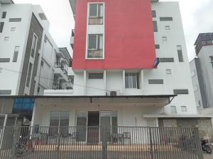 a red building on the side of a building at M Room Residence in Tangerang +9 photos