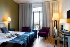 Postel nebo postele na pokoji v ubytování Elite Grand Hotel Norrköping