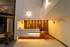 Ένα ή περισσότερα κρεβάτια σε δωμάτιο στο Hotel Kewal