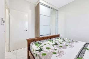 a bedroom with a bed and a window at Ravi’s Home in Berrimah