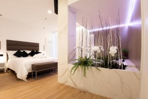A bed or beds in a room at POPULA - The Lifestyle Hotel