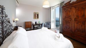 Postel nebo postele na pokoji v ubytování Albergo Ristorante Il Verbano