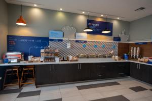 a kitchen with a counter top with aperature at Holiday Inn Mobile Downtown Historic District by IHG in Mobile +50 photos