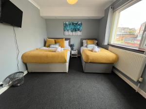 Katil atau katil-katil dalam bilik di Bright and Spacious Home in Port Tennant