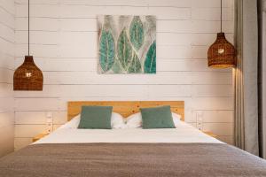 Postel nebo postele na pokoji v ubytování Lodges de Camargue