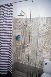 a shower with a glass door in a bathroom at Family House Pristol in Pristol +45 photos