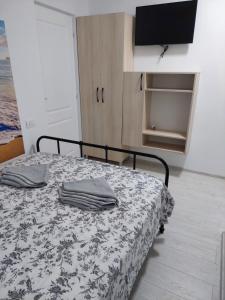 Postel nebo postele na pokoji v ubytování Vila de pe Lac Amara