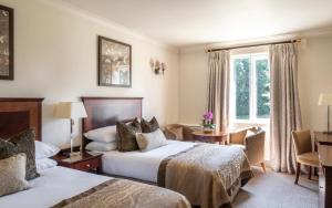 Postel nebo postele na pokoji v ubytování Audleys Wood Hotel, Basingstoke