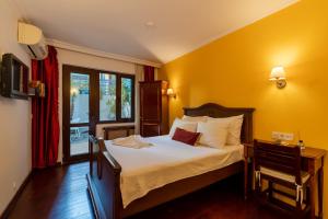 Postel nebo postele na pokoji v ubytování Şebnem Hotel